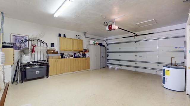 garage with electric water heater and a garage door opener