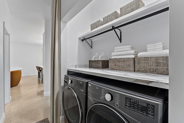 513 E Whitney Dr, Jupiter, FL 33458 - laundry room with washer and dryer and baseboards