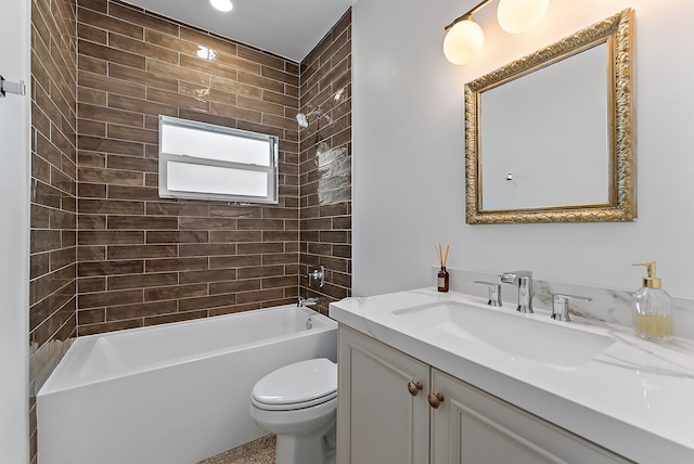 full bathroom with vanity, toilet, and tiled shower / bath