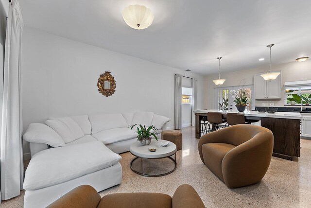 513 E Whitney Dr, Jupiter, FL 33458 - living area featuring dark speckled floor