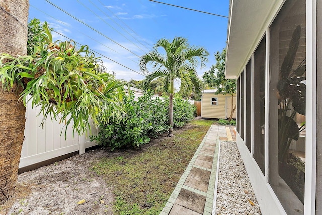 view of yard featuring a storage shed