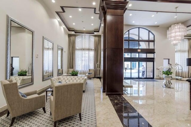 common area featuring a towering ceiling and recessed lighting