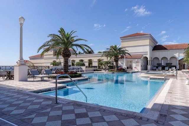 community pool featuring a patio area