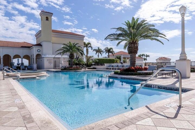 community pool featuring a patio area