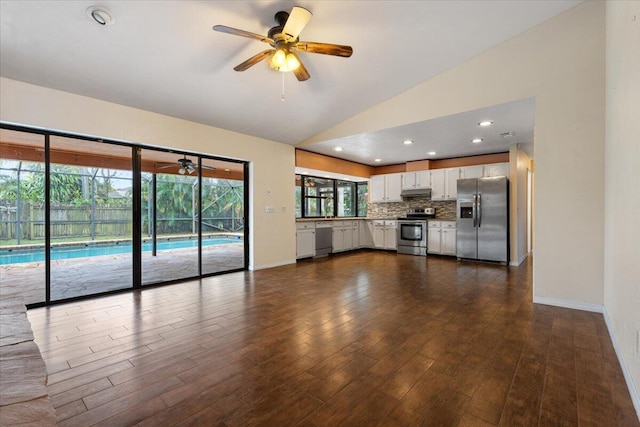 unfurnished living room with lofted ceiling, dark wood-type flooring, and ceiling fan