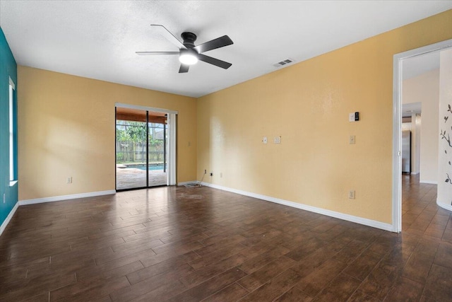 unfurnished room featuring ceiling fan and dark hardwood / wood-style flooring