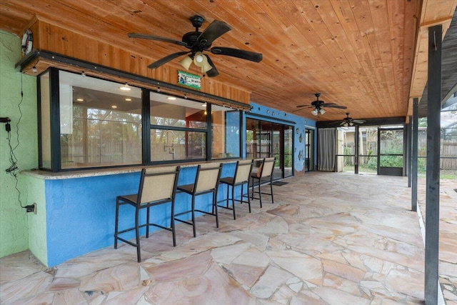 unfurnished sunroom with wooden ceiling