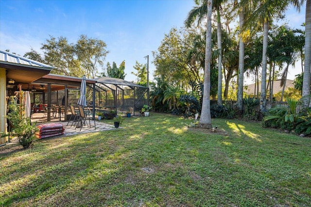 view of yard featuring a lanai and a patio area