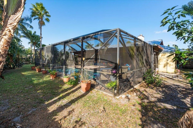 view of yard with a lanai