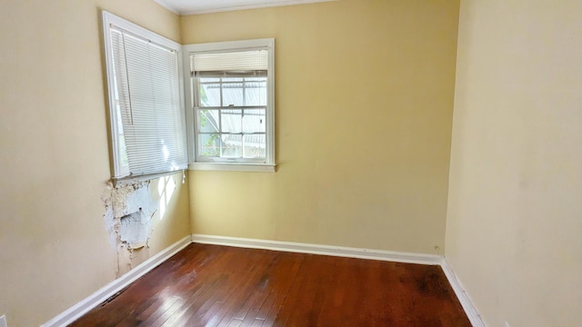 unfurnished room featuring dark hardwood / wood-style flooring