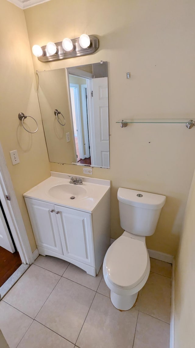 bathroom with tile patterned floors, vanity, and toilet