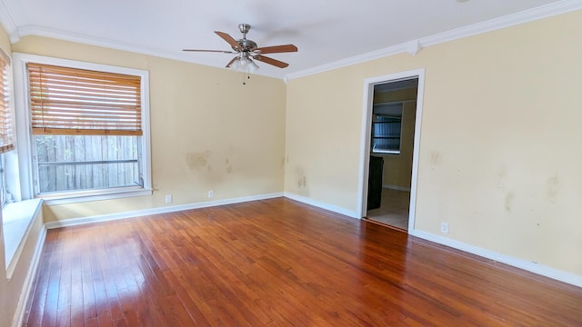 empty room with hardwood / wood-style floors, ceiling fan, and crown molding