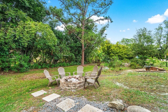 view of yard with an outdoor fire pit