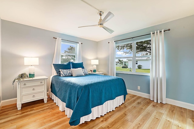 bedroom featuring light hardwood / wood-style flooring and ceiling fan