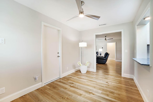 interior space with ceiling fan and light hardwood / wood-style floors