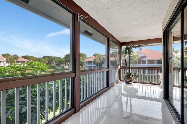 sunroom featuring a healthy amount of sunlight