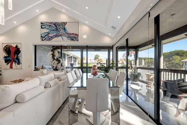 dining space featuring lofted ceiling