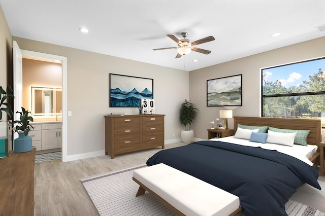 bedroom featuring recessed lighting, connected bathroom, light wood-style flooring, and baseboards