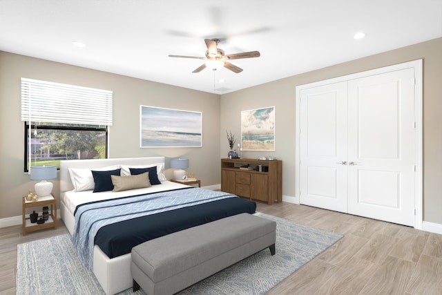 bedroom featuring ceiling fan, recessed lighting, light wood-style flooring, and baseboards