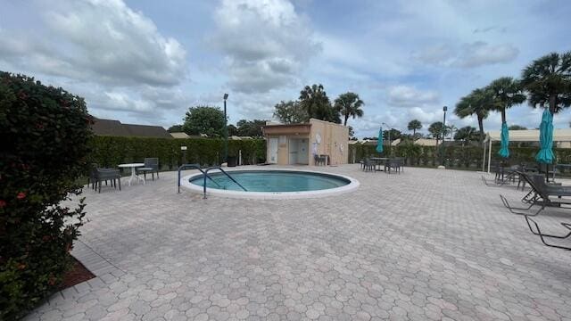 view of pool featuring a patio area