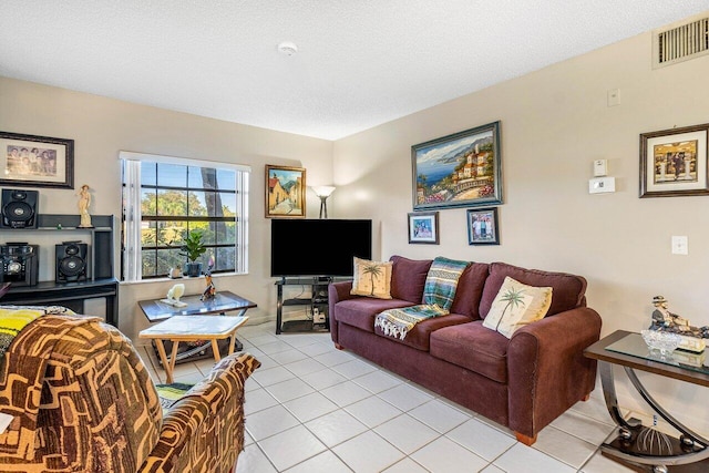 tiled living room with a textured ceiling