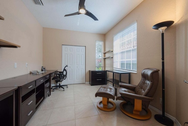 office area with ceiling fan and light tile patterned floors