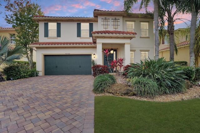 mediterranean / spanish-style home featuring a garage