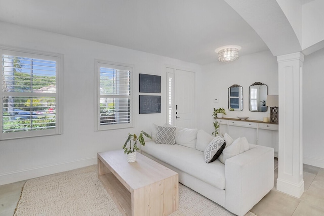 living room with decorative columns