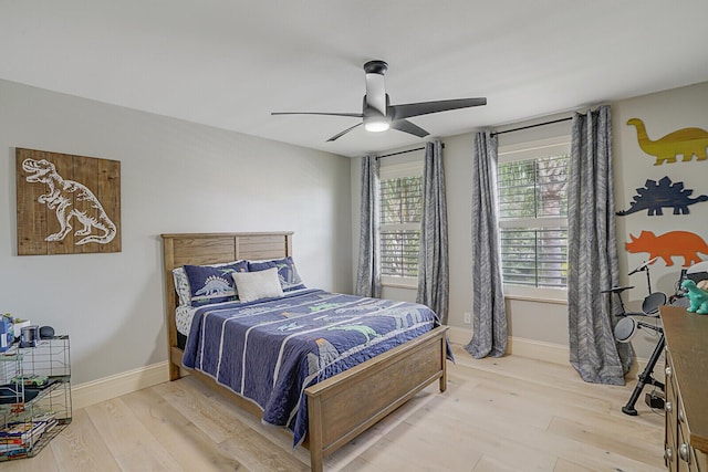 bedroom featuring ceiling fan and hardwood / wood-style flooring