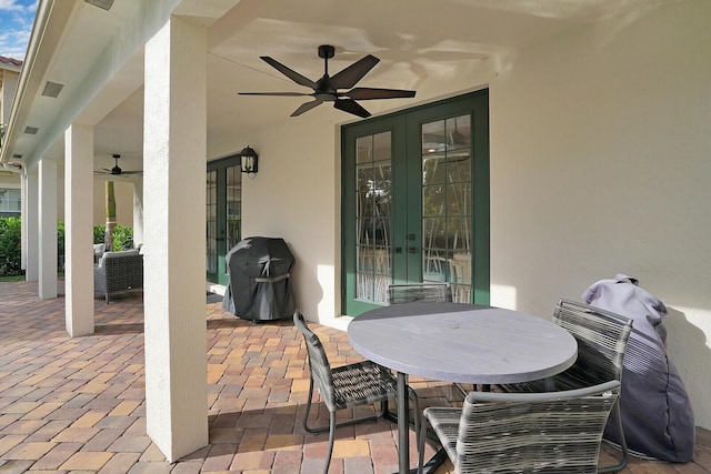 view of patio with french doors, grilling area, and ceiling fan