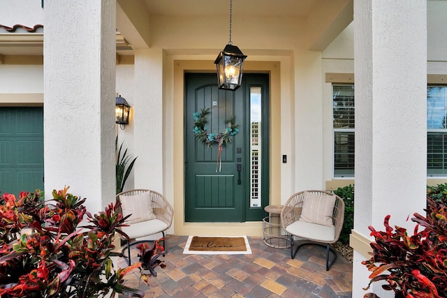 doorway to property with a garage