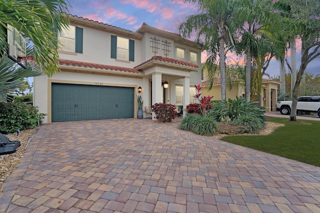 mediterranean / spanish-style house featuring a garage