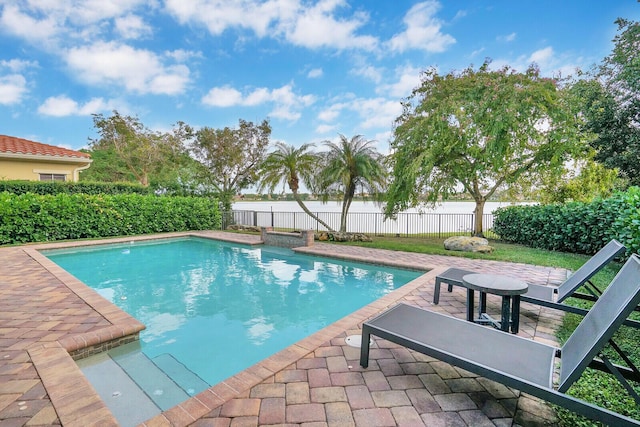 view of swimming pool with a patio area