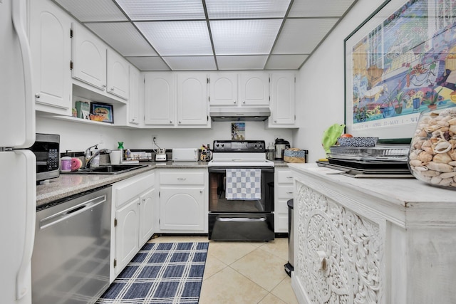 kitchen featuring sink, white cabinets, light tile patterned floors, and appliances with stainless steel finishes