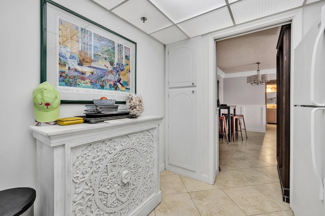 hallway with light tile patterned floors