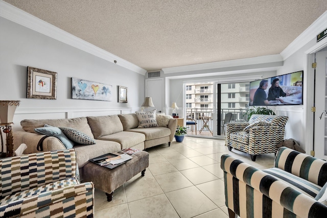 living room featuring light tile patterned floors, a textured ceiling, and crown molding