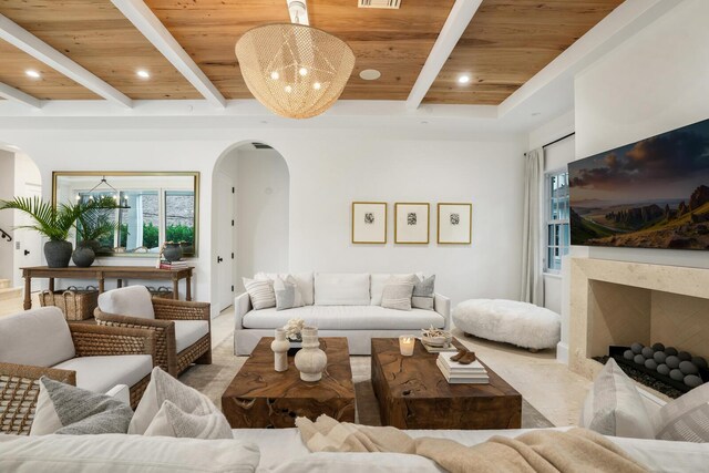 dining room featuring beam ceiling, sink, wooden ceiling, and a notable chandelier