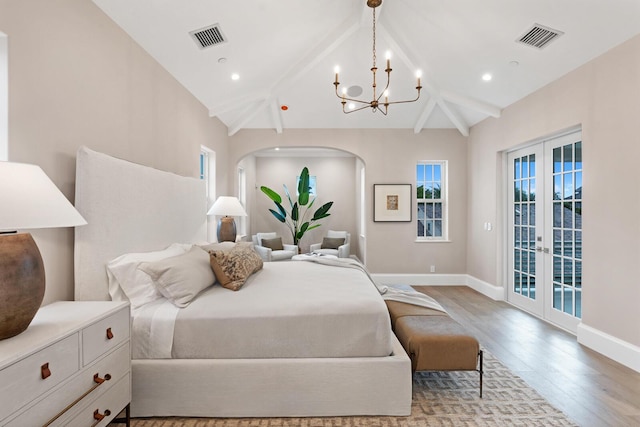 bedroom with french doors, light hardwood / wood-style flooring, lofted ceiling with beams, a notable chandelier, and access to outside