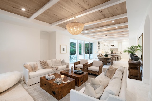 living room featuring beam ceiling and wooden ceiling