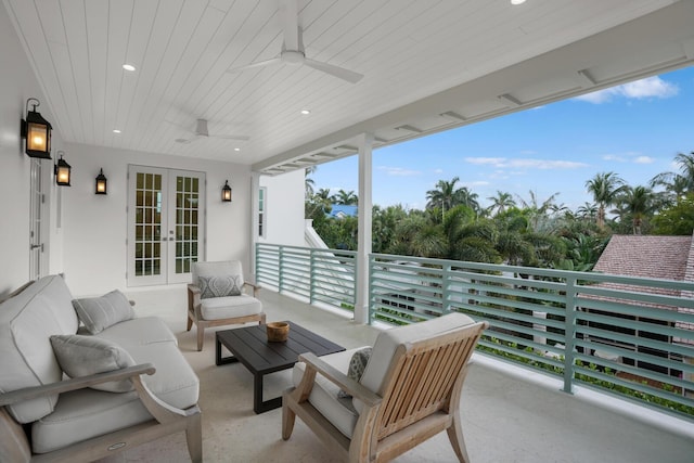 view of patio featuring ceiling fan, a balcony, an outdoor hangout area, and french doors