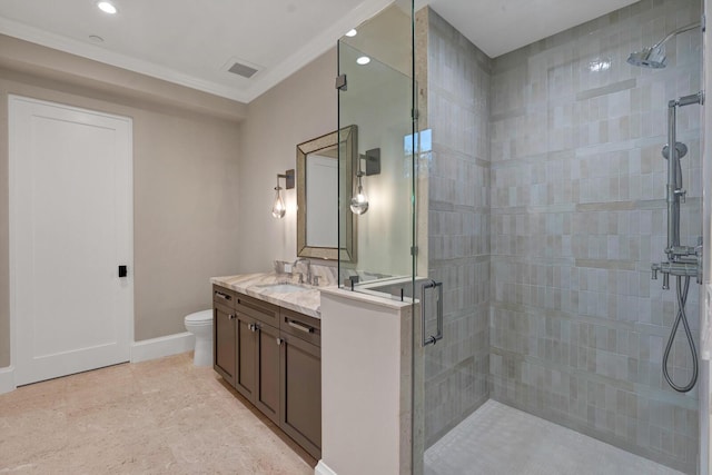 bathroom with vanity, toilet, and a shower with door