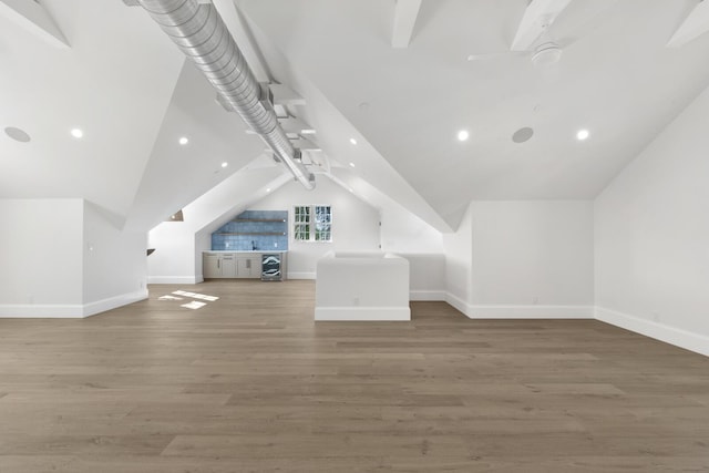 bonus room featuring hardwood / wood-style flooring and vaulted ceiling