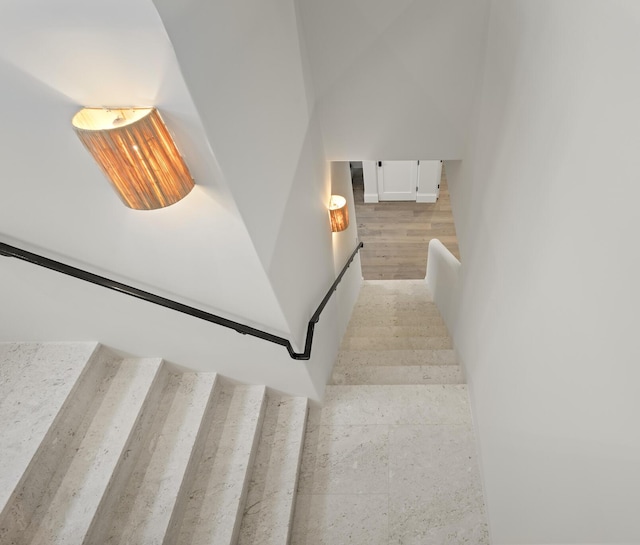 stairway with hardwood / wood-style flooring