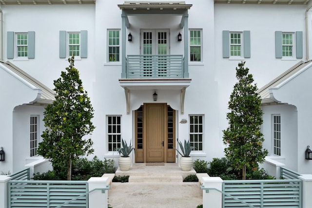 1114 N Vista Del Mar Dr, Delray Beach, FL 33483 - view of front of home featuring a balcony and stucco siding