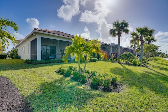 view of yard with ceiling fan