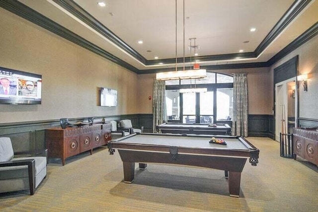 playroom with light carpet, a raised ceiling, ornamental molding, and pool table