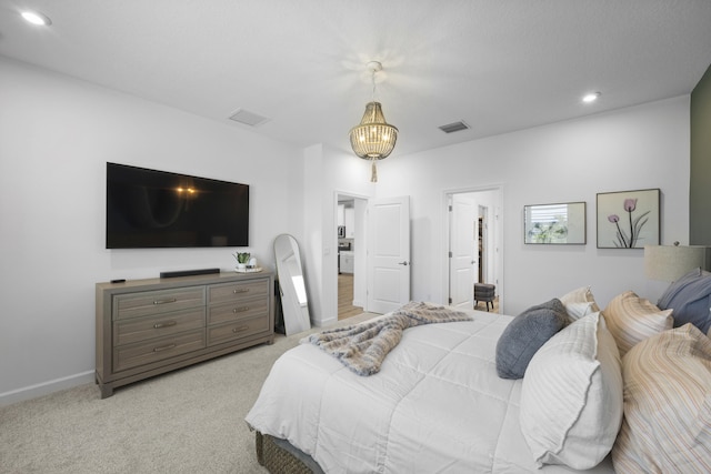 bedroom featuring light carpet