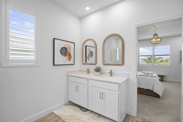 bathroom featuring vanity and hardwood / wood-style floors