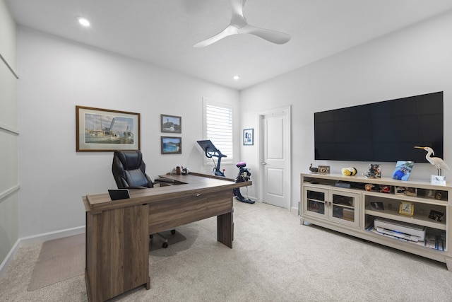 carpeted home office with ceiling fan