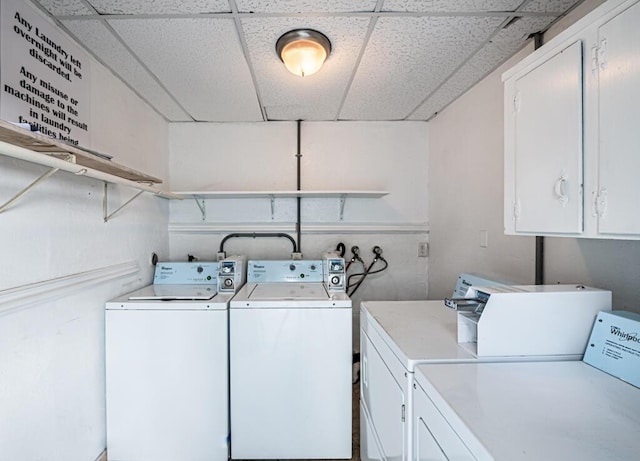 clothes washing area with separate washer and dryer